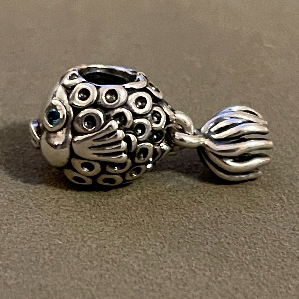Fish charm with a dangly tail